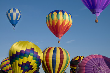 Image showing Hot-air balloon ascending over others