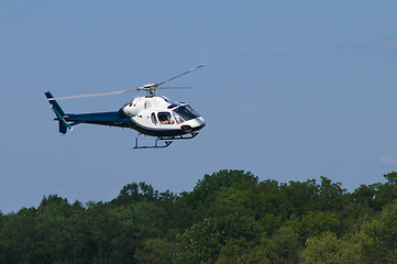 Image showing Helicopter landing or taking off