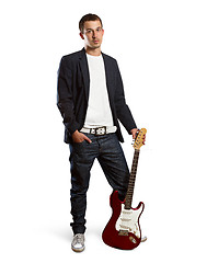 Image showing stylish man with guitar looking at camera