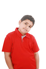 Image showing Portrait of a happy little young boy standing with hands in pock