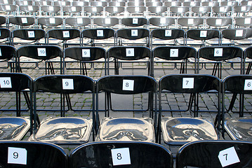 Image showing Black plastic chairs 