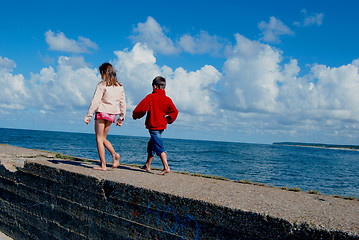 Image showing Boy and girl near the sea 