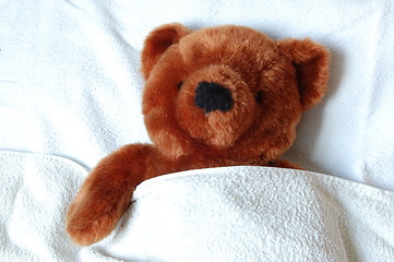 Image showing sick teddy with injury in bed