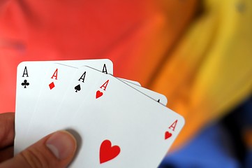 Image showing hand holding four aces