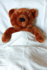 Image showing sick teddy with injury in bed