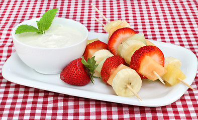 Image showing Fresh fruit kabobs and dip