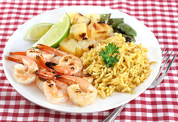 Image showing Barbecued Shrimp, rice curry, pineapple, peppers and lime.