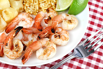 Image showing Barbecued Shrimp with pineapple, rice and lime.  Selective focus