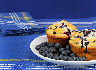 Image showing Fresh and healthy bueberries and blueberry muffins