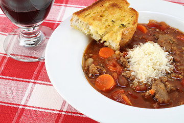 Image showing Minestrone Soup and garlic bread.