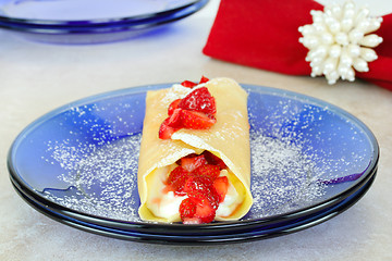 Image showing Strawberry crepes or pancakes with selective focus.