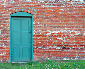 Image showing Rustic Green Door in old brick wall.