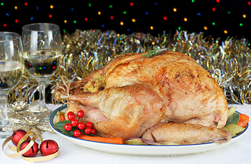 Image showing Whole Roasted, Stuffed Turkey in an Evening Christmas Setting