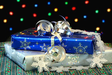 Image showing Christmas Gifts in front of Bokeh Lights