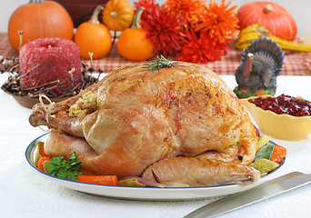 Image showing Whole roasted turkey in Thanksgiving setting.