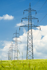 Image showing high voltage power lines against a blue sky