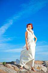 Image showing  beautiful woman  in white on seacoast 