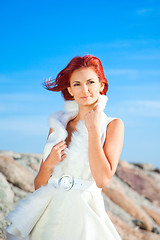 Image showing  beautiful woman  in white on seacoast