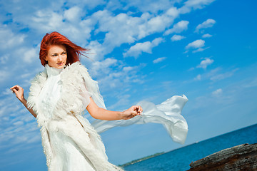 Image showing  beautiful woman  in white on seacoast