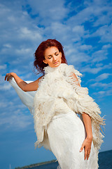 Image showing  beautiful woman  in white on seacoast