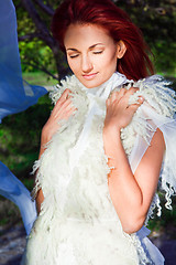 Image showing beautiful woman in white in sun beam