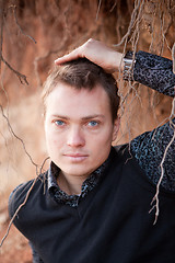 Image showing Portrait of a man with tree root on background