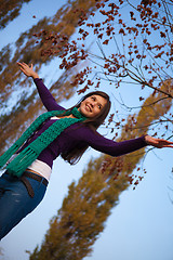 Image showing Young girl with raised arms