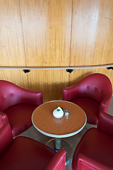 Image showing leather chairs and wooden tables