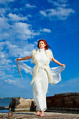 Image showing  beautiful woman  in white on seacoast