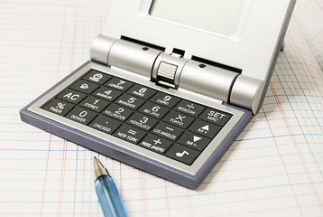 Image showing Calculator and Ballpen