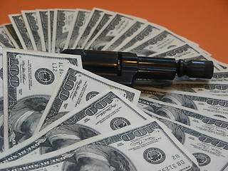 Image showing Money and a revolver