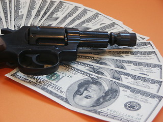 Image showing Money and a revolver