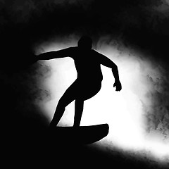 Image showing Silhouette Surfer Riding Wave 