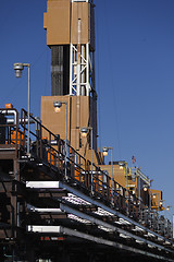 Image showing production line and drilling rig derrick