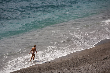 Image showing Walking along the coast