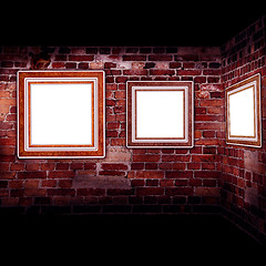 Image showing Art gallery. Frames old leather on a brickwall.