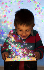 Image showing Child peeping in a gift box