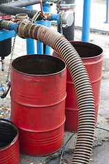 Image showing Truck Hoses for fuel station, pumps and oil barrels