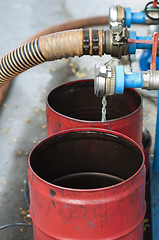 Image showing Truck Hoses for fuel station, pumps and oil barrels