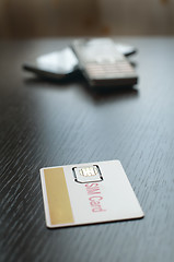 Image showing SIM card and mobile phone