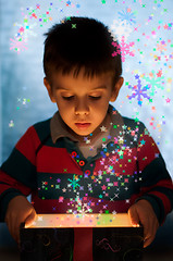 Image showing Child peeping in a gift box