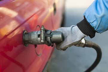 Image showing Loading a car with gas