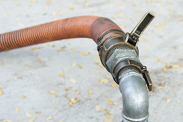 Image showing Truck Hoses for fuel station, pumps and oil barrels