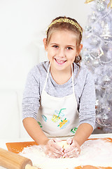 Image showing Cute girl baking cookies