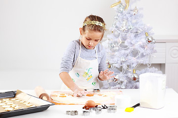 Image showing Cute girl baking cookies