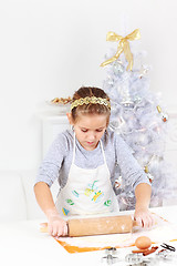 Image showing Cute girl baking cookies