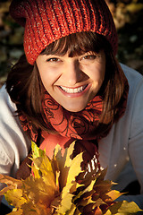 Image showing woman with autumn leaves