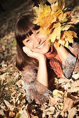 Image showing woman with autumn leaves