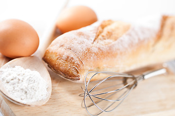 Image showing  bread, flour, eggs and kitchen utensil 