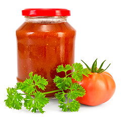 Image showing Tomato ketchup with tomato and parsley